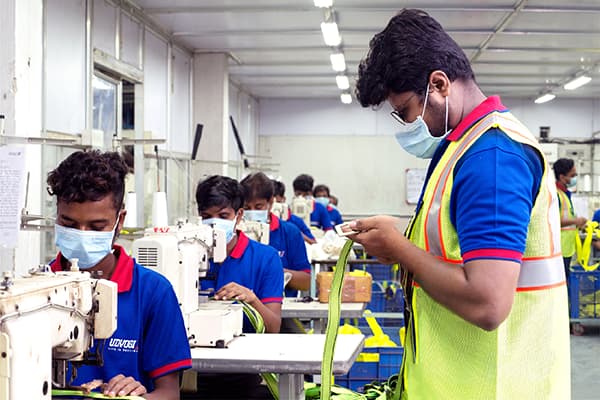 Industrial safety professionals collaborating in manufacturing facility